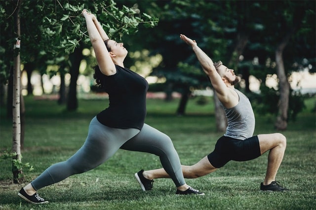 Plus size and lean doing yoga