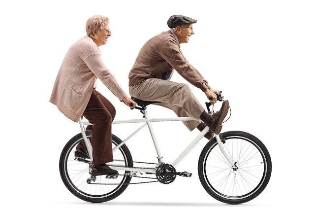 Old man and woman on a bicycle