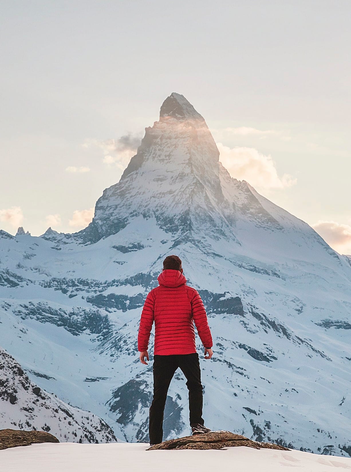 Man in front of snow mountain