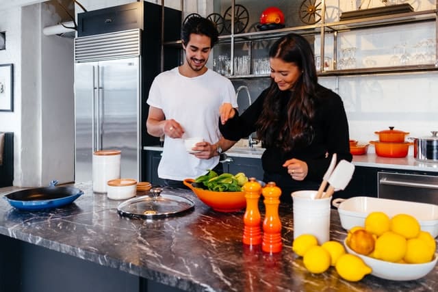 couple cooking healthy food together photo by Jason Briscoe