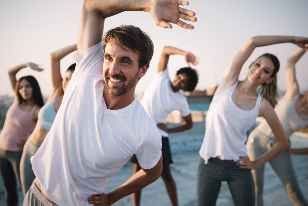 Group of happy people exercising 1000px
