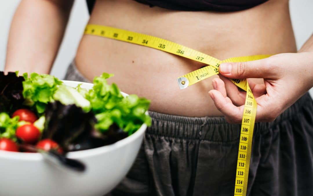 Women measuring her belly